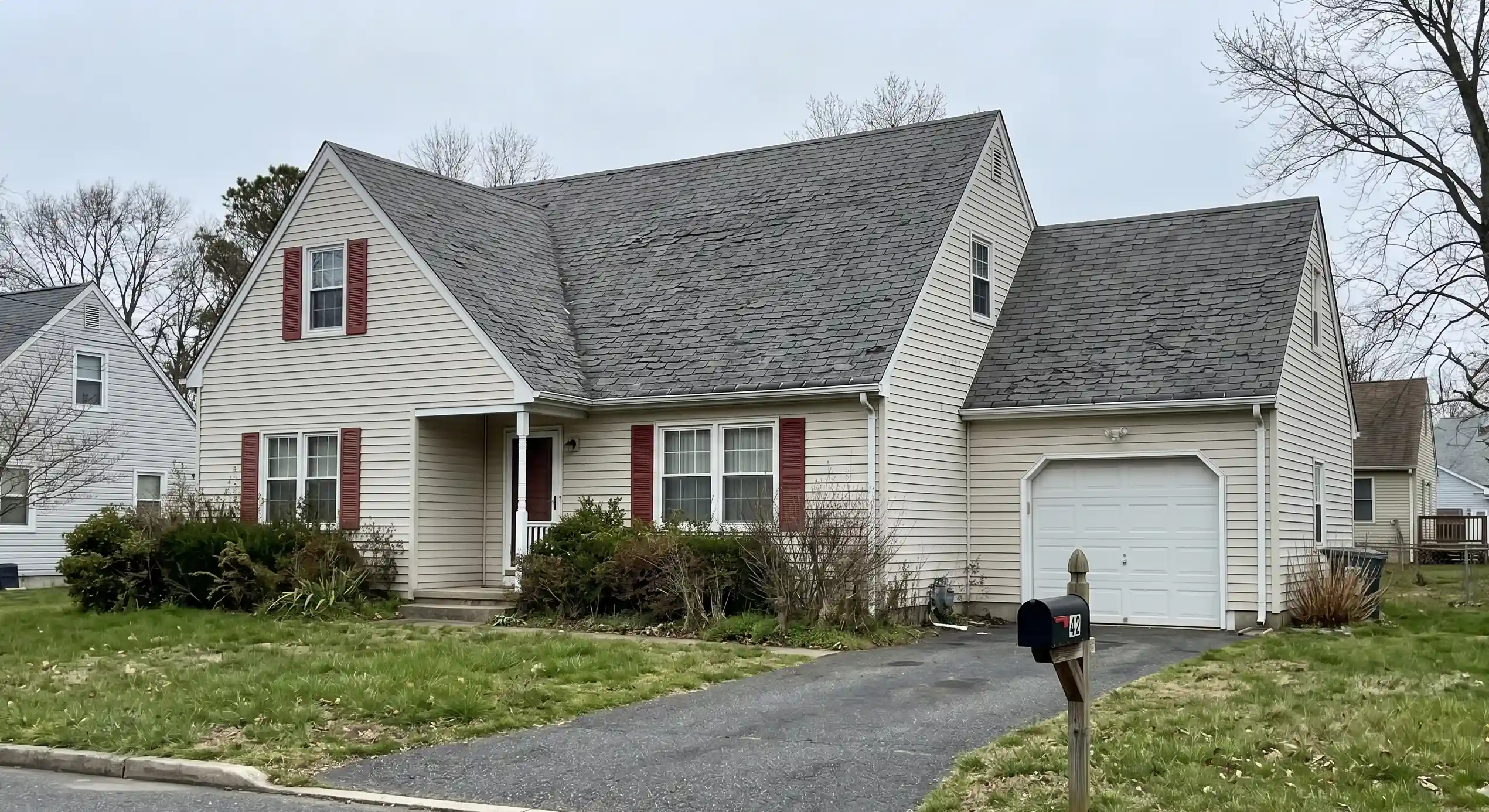 Worn architectural shingle roof before replacement